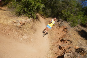 Doc bombing down the hill in the hot sun