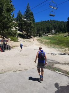 Leaving the aid-station in the heat of the day. Photo by: Not Chris